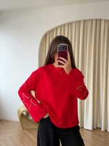 Sweat à étoiles cloutées